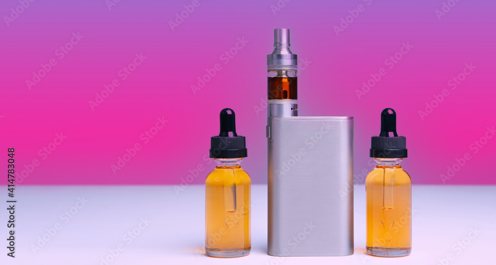 VAPE and vials of liquid on the table. Smoking electronic cigarettes. The concept of vaping. Accessories for vaper. E-cigarette. Smoking liquid. Shop for vapers. VAPE and vials of liquid on the table. Smoking electronic cigarettes. The concept of vaping. Accessories for vaper. E-cigarette. Smoking liquid. Shop for vapers.