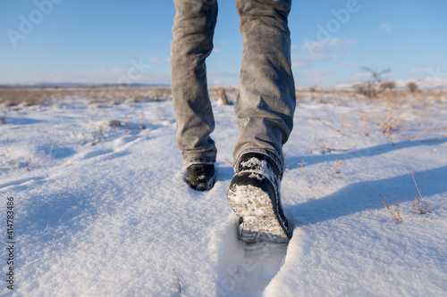 man walking in the snow