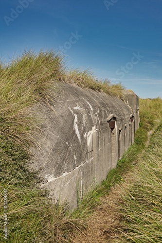 bunker ruin at beach near Houvig, Jutland, Denmark, grassland on dune2 photo