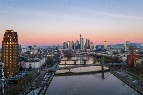 Aerial panoramic picture of Frankfurt skyline with river Main with colorful sky during sunrise