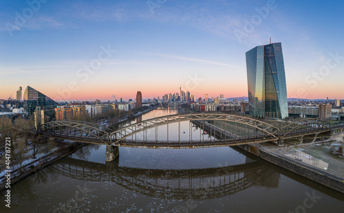 Aerial panoramic picture of Deutschherrnbrücke with Frankfurt skyline during sunrise