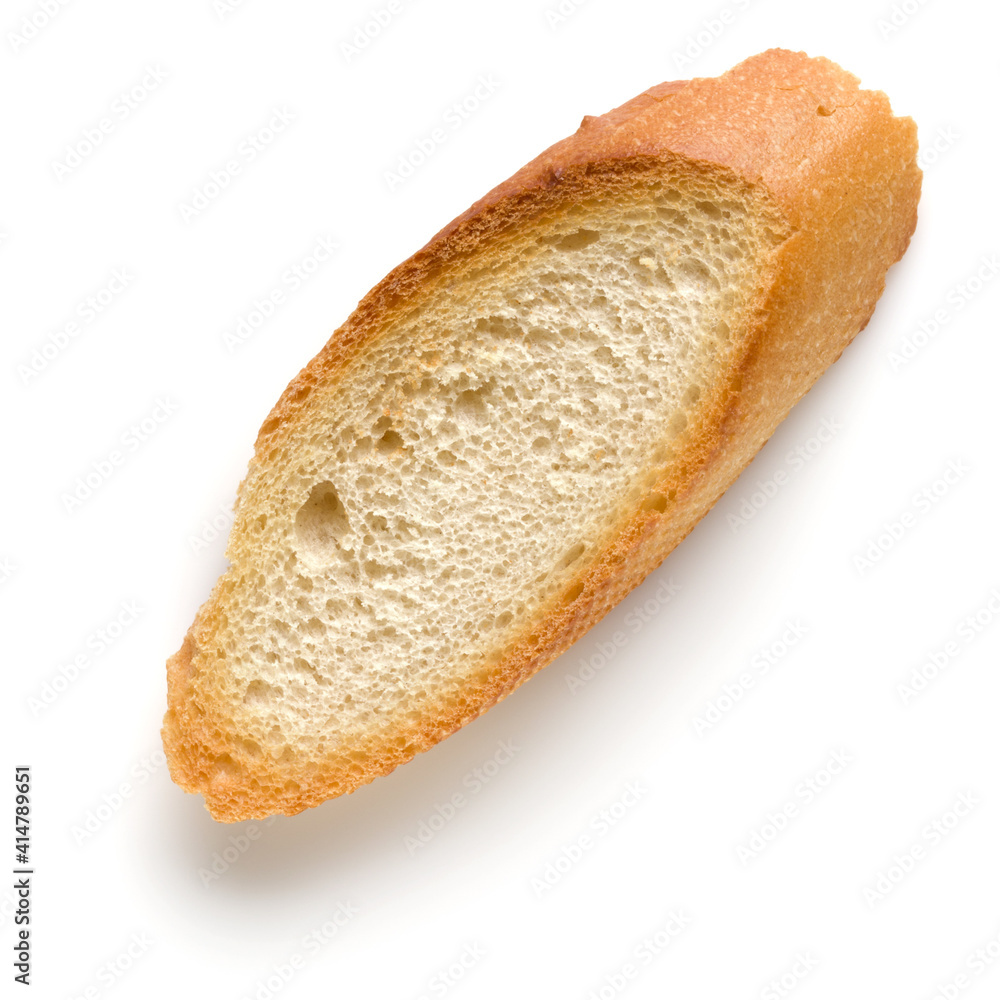 Toasted baguette slice isolated on white background close up. Toast, crouton. Top view. Toasted baguette slice isolated on white background close up. Toast, crouton. Top view.