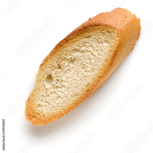 Toasted baguette slice isolated on white background close up. Toast, crouton. Top view.