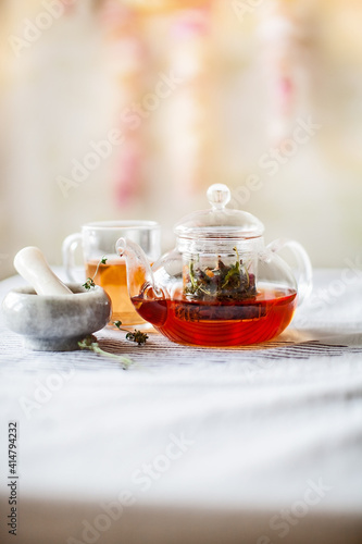 homemade herbal tea in a glass teapot