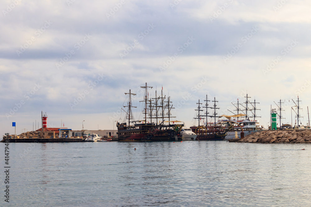 Stylized pirate yachts in marina harbor in Kemer, Turkey