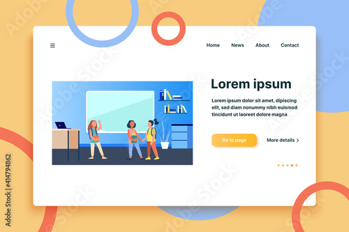 Schoolgirls meeting in classroom. Group of friends, classmates holding hands, waving hello flat vector illustration. Communication, friendship concept for banner, website design or landing web page
