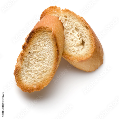 Toasted baguette slices isolated on white background close up.  Toast, crouton.   Top view.