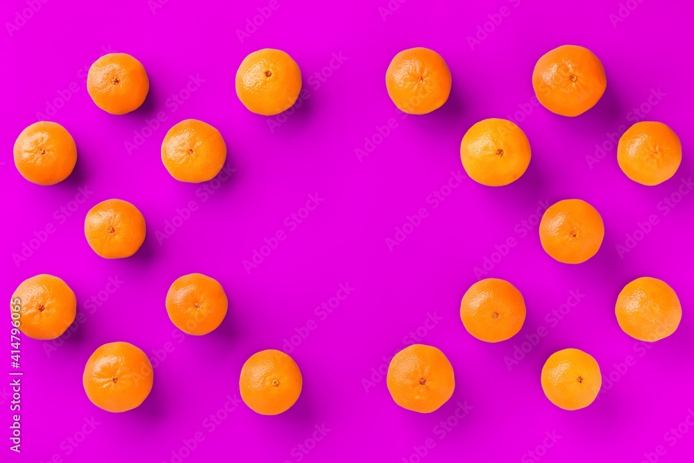 Fruit pattern of fresh orange tangerine or mandarin on lilac background. Flat lay, top view. Pop art design, creative summer concept. Citrus in minimal style. Fruit pattern of fresh orange tangerine or mandarin on lilac background. Flat lay, top view. Pop art design, creative summer concept. Citrus in minimal style.
