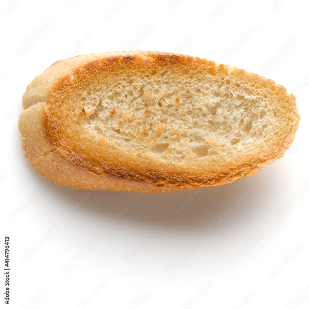 Toasted baguette slice isolated on white background close up. Toast, crouton. Top view. Toasted baguette slice isolated on white background close up. Toast, crouton. Top view.