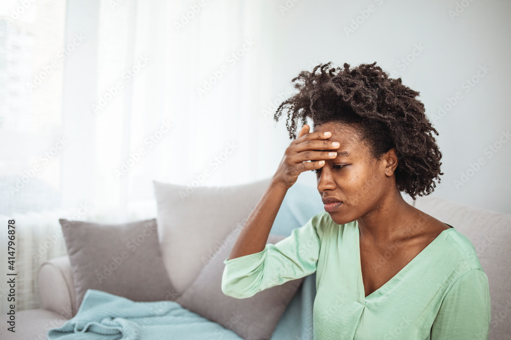 Female with mood disorder having a headache. Young hopeless woman suffering from depression having nervous breakdown holding head. Young woman feeling stressed and depressed Female with mood disorder having a headache. Young hopeless woman suffering from depression having nervous breakdown holding head. Young woman feeling stressed and depressed