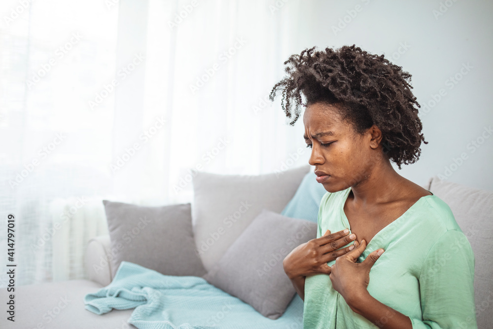 Pressure in the chest. Closeup photo of a stressed woman who is
