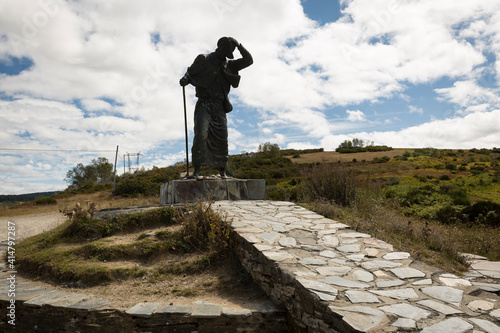 silhouette of a big statue of a pilgrim at the Alto de San Roque in Linares (Pedrafita do Cebreiro), province of Lugo, Galicia, Spain photo