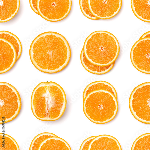 Seamless pattern of orange fruit slices. Orange slices isolated on white background. Food background. Flat lay, top view.