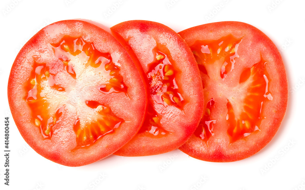 Slices of tomato isolated on white background. Top view, flat lay. Slices of tomato isolated on white background. Top view, flat lay.