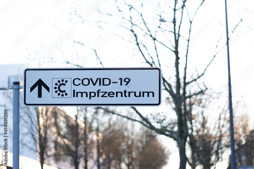 Road sign with sign for the vaccination centre in times of covid 19 and corona taken in Bad Homburg, Germany, 13.02.2021 Road sign with sign for the vaccination centre in times of covid 19 and corona taken in Bad Homburg, Germany, 13.02.2021