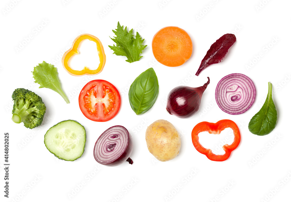 Creative layout made of tomato slice, onion, cucumber, basil leaves. Flat lay, top view. Food concept. Vegetables isolated on white background. Food ingredient pattern. Creative layout made of tomato slice, onion, cucumber, basil leaves. Flat lay, top view. Food concept. Vegetables isolated on white background. Food ingredient pattern.