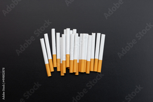 Cigarette on dark background. Non smoking for health concept