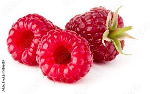 three ripe raspberries isolated on white background close up