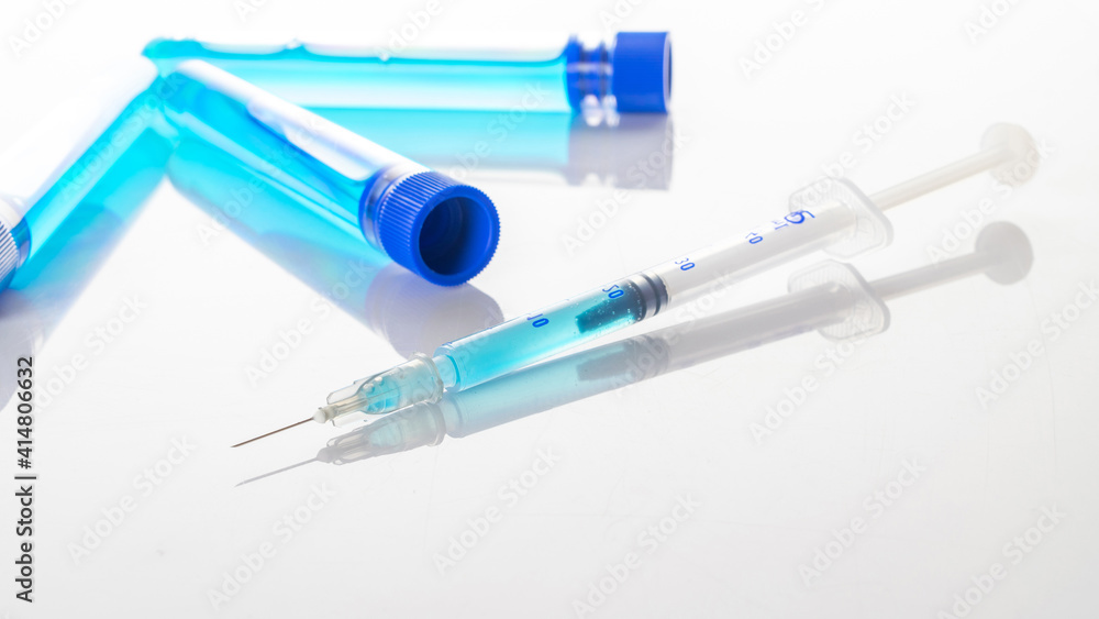 Vaccine vial. Medical syringe with needle for protection flu virus and coronavirus. Covid inoculation on white. Close up vaccine vial dose flu shot drug needle syringe. Vaccine vial. Medical syringe with needle for protection flu virus and coronavirus. Covid inoculation on white. Close up vaccine vial dose flu shot drug needle syringe.
