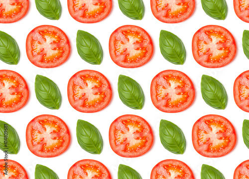 Creative layout made of tomato slices. Flat lay, top view. Vegetables isolated on white background. Food ingredient seamless pattern...
