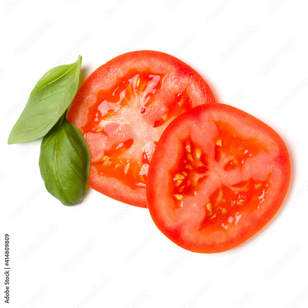 Slices of tomato and basil leaves isolated on white background. Top view, flat lay...
