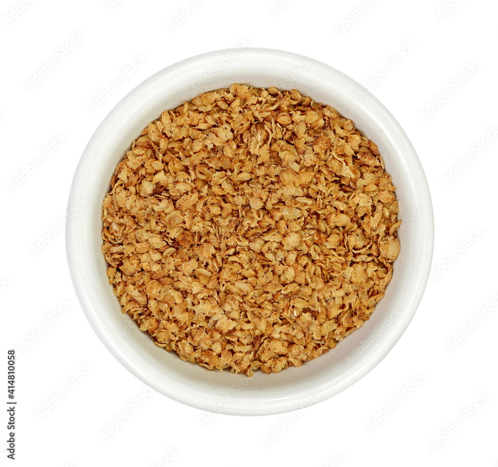 Buckwheat flakes in a bowl isolated on white background. Healthy buckwheat flakes. Healthy food. Buckwheat flakes in a bowl isolated on white background. Healthy buckwheat flakes. Healthy food.