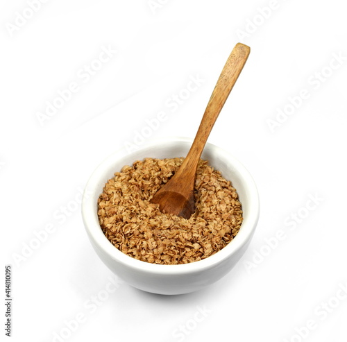 Fototapeta Naklejka Na Ścianę i Meble -  Buckwheat flakes in a bowl isolated on white background. Healthy buckwheat flakes. Healthy food.