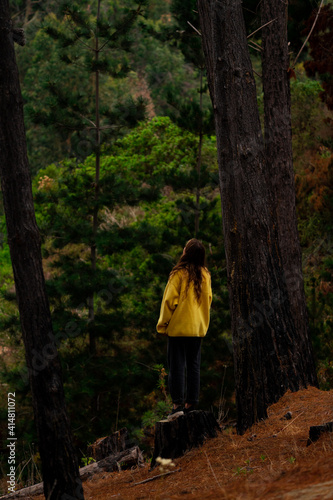 woman walking in autumn forest