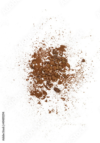 Cocoa nibsand cocoa powder isolated on white. A pieces of broken cocoa beans isolated on white background.