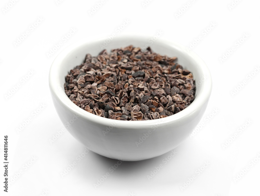 Cocoa nibs, a pieces of broken cocoa beans isolated on white background. Cocoa nibs, a pieces of broken cocoa beans isolated on white background.