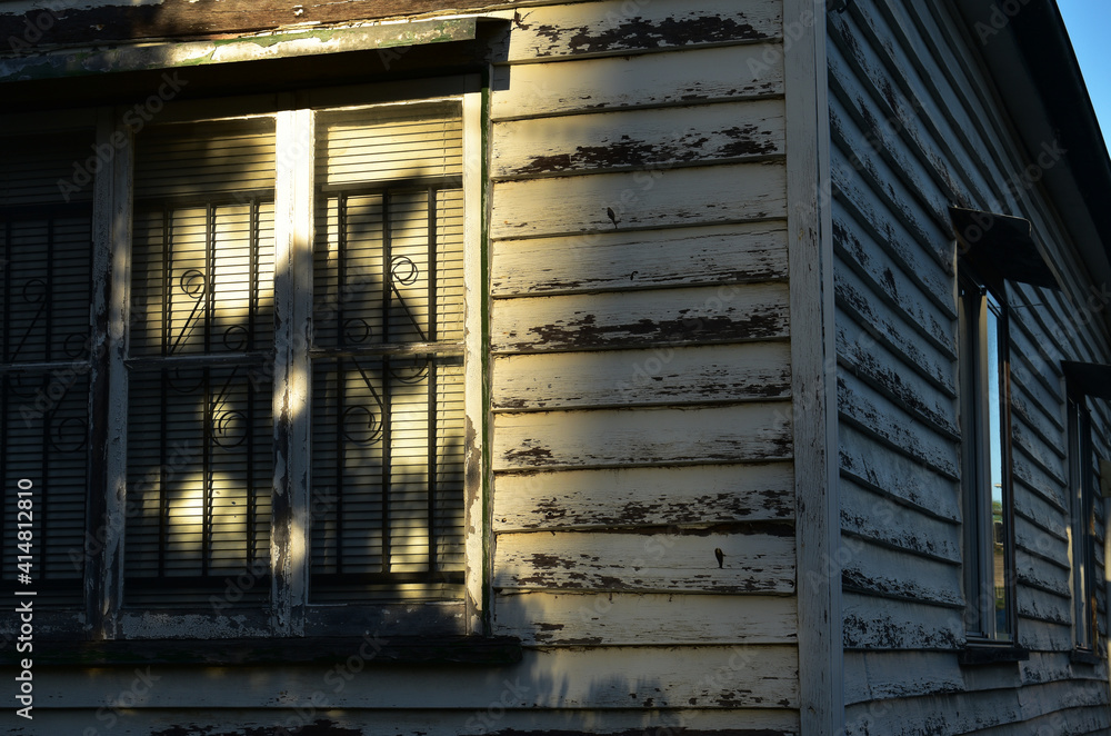 exterior corner of old wooden house, queenslanderstyle, casement