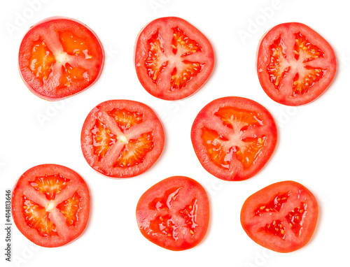 Creative layout made of tomato slices. Flat lay, top view. Food concept. Vegetables isolated on white background. Food ingredients pattern.