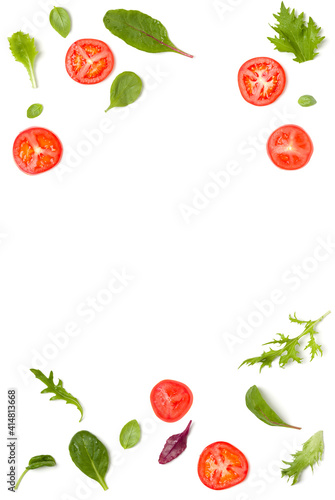 Creative layout made of tomato slices and lettuce salad leaves. Flat lay  top view. Food concept. Vegetables isolated on white background. Food ingredients pattern with copy space.