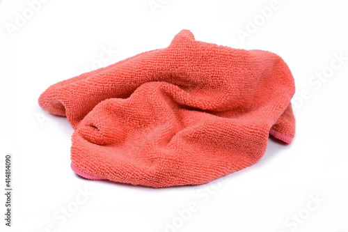 Red micro fiber towel isolated on white background. Clean, new red microfiber cloth isolated on white background