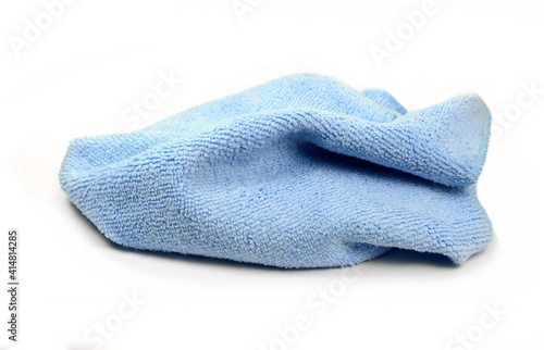 Blue micro fiber towel isolated on white background. Clean, new blue microfiber cloth isolated on white background