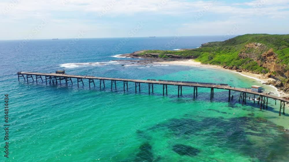 Aerial: Catherine Hill Bay pier and turquoise seascape, Australia east coast Aerial: Catherine Hill Bay pier and turquoise seascape, Australia east coast