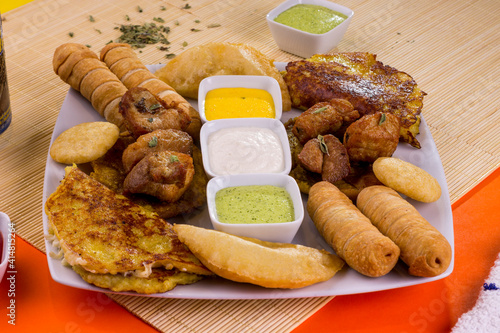 Comida venezolana piqueo con cremas en plato para restaurantes photo