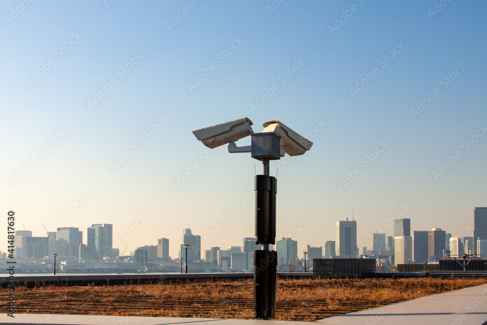 CCTV cameras and surveillance security system faces Tokyo skyline CCTV cameras and surveillance security system faces Tokyo skyline