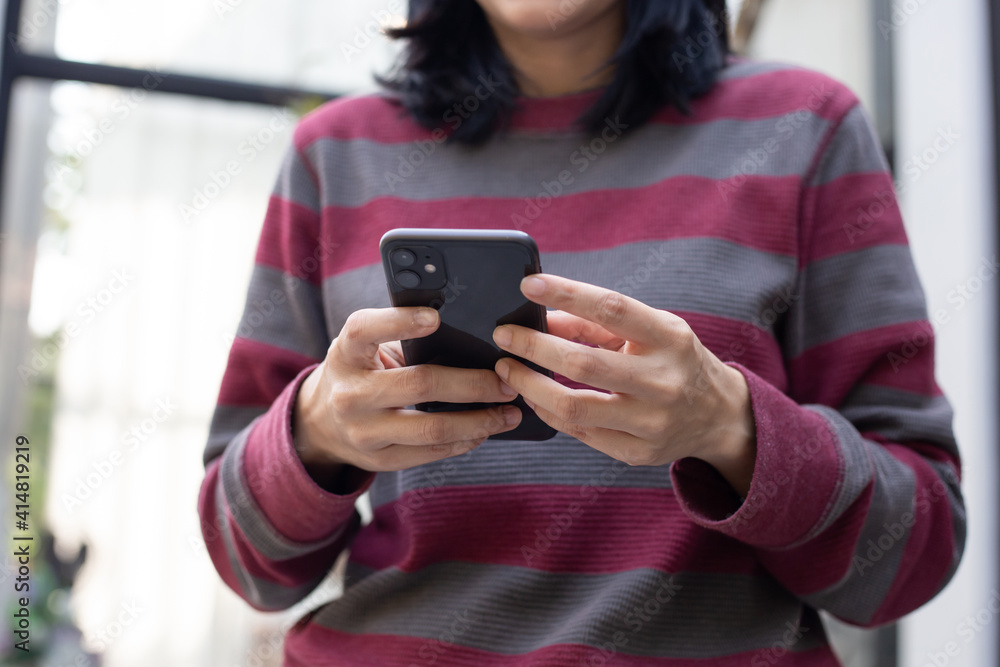 using cell phone hand holding mobile texting message contact us.chatting,search internet information in office.technology device communication connecting using cell phone hand holding mobile texting message contact us.chatting,search internet information in office.technology device communication connecting