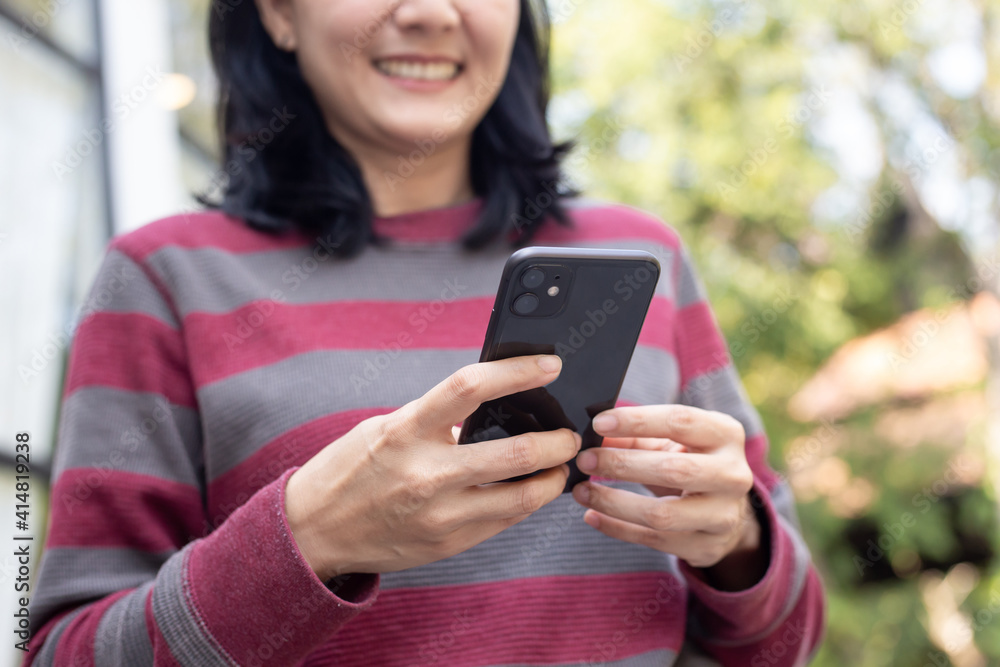 using cell phone hand holding mobile texting message contact us.chatting,search internet information in office.technology device communication connecting using cell phone hand holding mobile texting message contact us.chatting,search internet information in office.technology device communication connecting