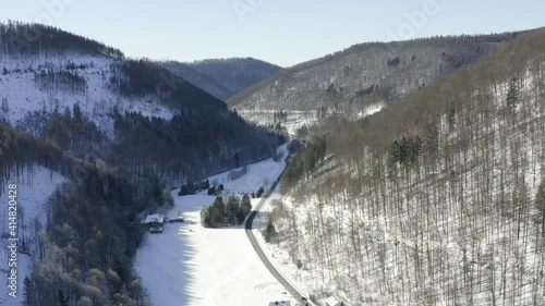 Aerial footage of the harz after a heavy snow storm in the winter of 2021. The Harz is a german national Park in with beautiful mountain landscapes in central Germany, Europe. photo