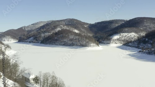 Aerial footage of the harz after a heavy snow storm in the winter of 2021. The Harz is a german national Park in with beautiful mountain landscapes in central Germany, Europe. photo