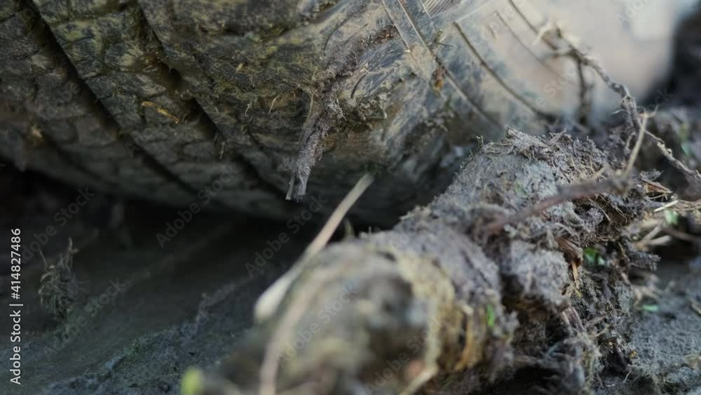 Truck Tires Stuck On A Muddy Field During An Off-Road Travel. - Slider, Macro Shot Truck Tires Stuck On A Muddy Field During An Off-Road Travel. - Slider, Macro Shot