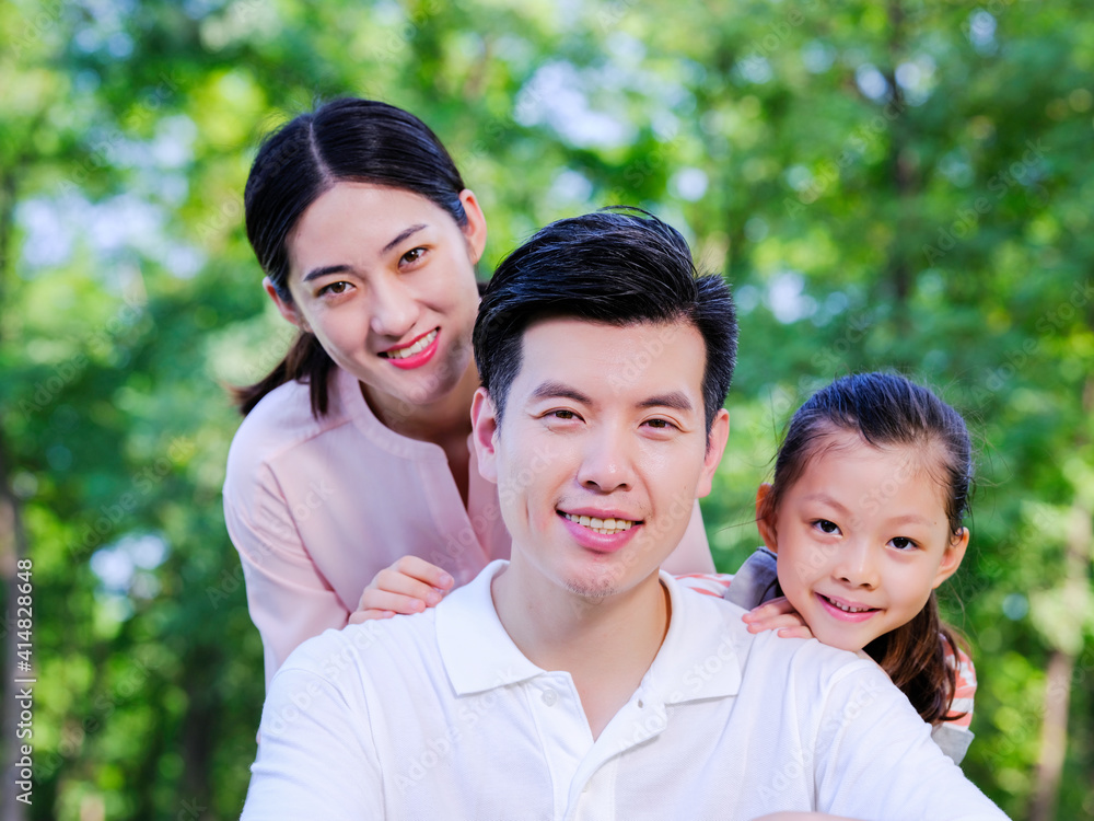 Outdoor portrait of a happy family of three Outdoor portrait of a happy family of three