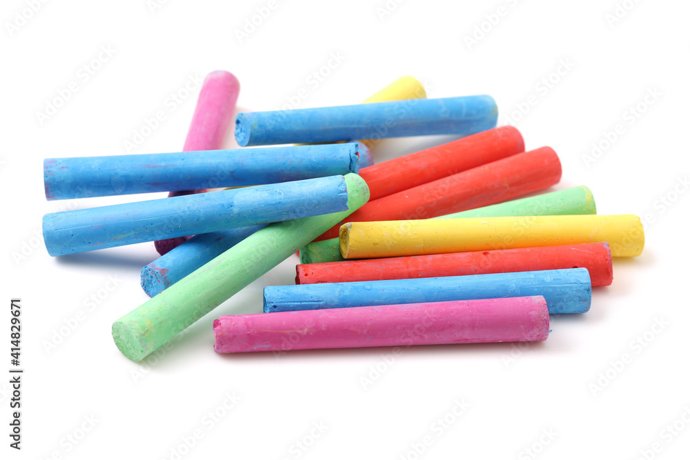 chalks in a variety of colors arranged on a white background chalks in a variety of colors arranged on a white background