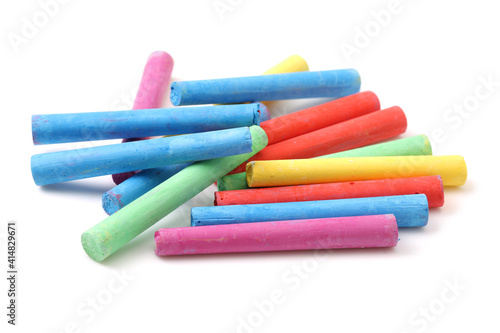 chalks in a variety of colors arranged on a white background