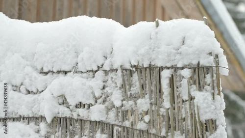 Wallpaper Mural The wooden fence covered with thick snow during the winter season Torontodigital.ca