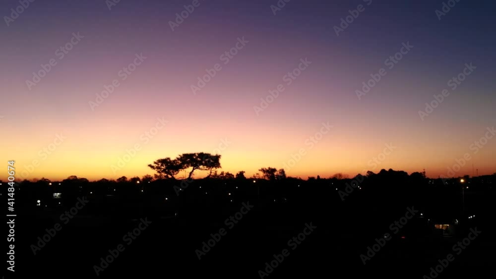 Drone flying backwards showing shade of trees Drone flying backwards showing shade of trees