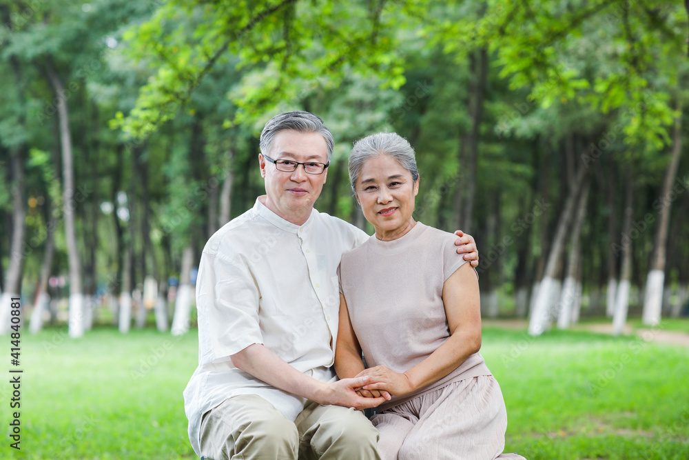 Happy old couple sitting on the park chair Happy old couple sitting on the park chair