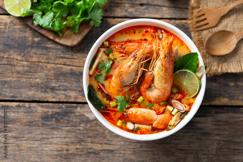 Tom Yam Kung ,Prawn and lemon soup with mushrooms, thai food in white bowl top view photo